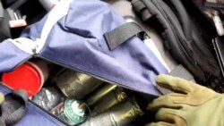 FILE - An apparent explosives cache is seen in a bag inside the vehicle used by a gunman in an attack on a synagogue in Halle, Germany, Oct. 9, 2019, in this still image taken from the gunman's helmet camera video stream.