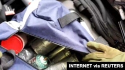 FILE - An apparent explosives cache is seen in a bag inside the vehicle used by a gunman in an attack on a synagogue in Halle, Germany, Oct. 9, 2019, in this still image taken from the gunman's helmet camera video stream.