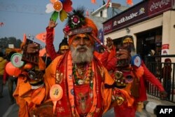 FILE - A Sadhu or an Indian holy man walks along a road in Ayodhya on January 21, 2024.