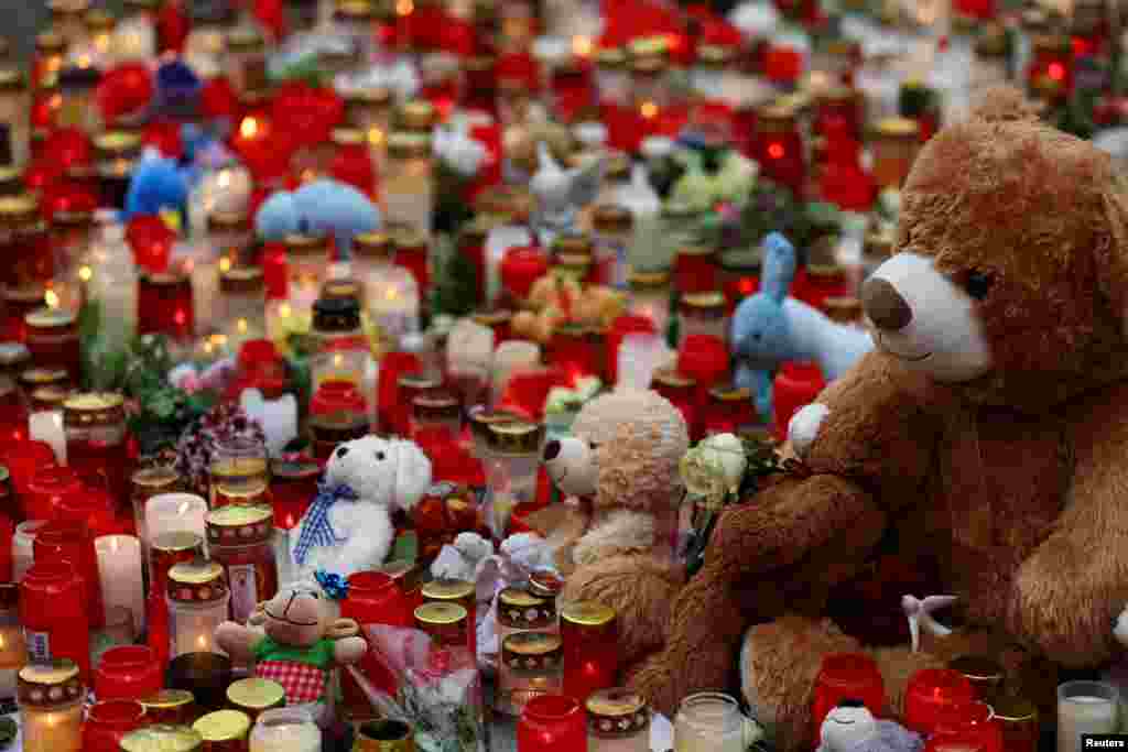 Tributes are placed at the scene of the crime after two people, including a child, were killed in a knife attack earlier this week, on the day of a memorial event held by the Alternative for Germany (AfD) party in Aschaffenburg, Germany.