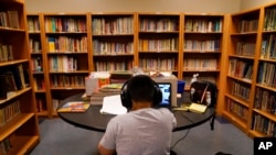 FILE - A Los Angeles Unified School District student attends an online class at Boys & Girls Club of Hollywood in Los Angeles, Aug. 26, 2020. 