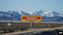 A billboard displays "Protect Thacker Pass" near the Fort McDermitt Paiute-Shoshone Indian Reservation on April 25, 2023, near McDermitt, Nev.