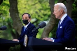FILE - Japan's Prime Minister Yoshihide Suga and U.S. President Joe Biden hold a joint news conference in the Rose Garden at the White House in Washington, April 16, 2021.