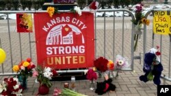 Flowers, signs and other items are seen in front of Union Station in Kansas City, Missouri, Feb. 16, 2024, following a shooting that took place during a Kansas City Chiefs Super Bowl victory rally. 