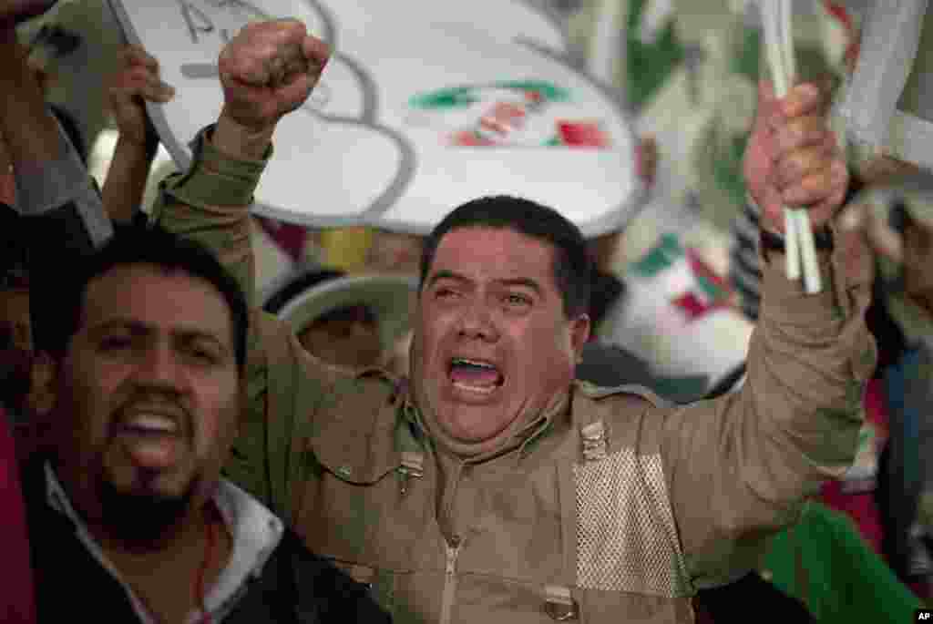 Supporters of Enrique Pena Nieto celebrate at the PRI party headquarters as results begin to come in on the general elections in Mexico City, July 1, 2012. 