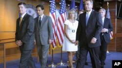 House Speaker John Boehner of Ohio, second from right, and fellow House Republicans leave a news conference on Capitol Hill in Washington, Thursday, July 28, 2011. From left are, Rep. Jeb Hensarling, R-Texas, House Majority Leader Eric Cantor of Va., Rep.