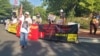 Yin Aye, an activist for Myanmar's independence from a military junta that took power in a 2021 coup, leads protesters in shouting their demands in front of the Chinese Embassy in Washington on Sept. 14, 2024.