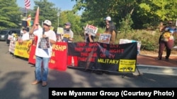 Yin Aye, an activist for Myanmar's independence from a military junta that took power in a 2021 coup, leads protesters in shouting their demands in front of the Chinese Embassy in Washington on Sept. 14, 2024.