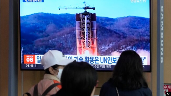 A TV screen shows a file image of North Korea's rocket launch during a news program at the Seoul Railway Station in Seoul, South Korea, May 29, 2023. Japan's coast guard said North Korea has notified it that it plans to launch a satellite in coming days.