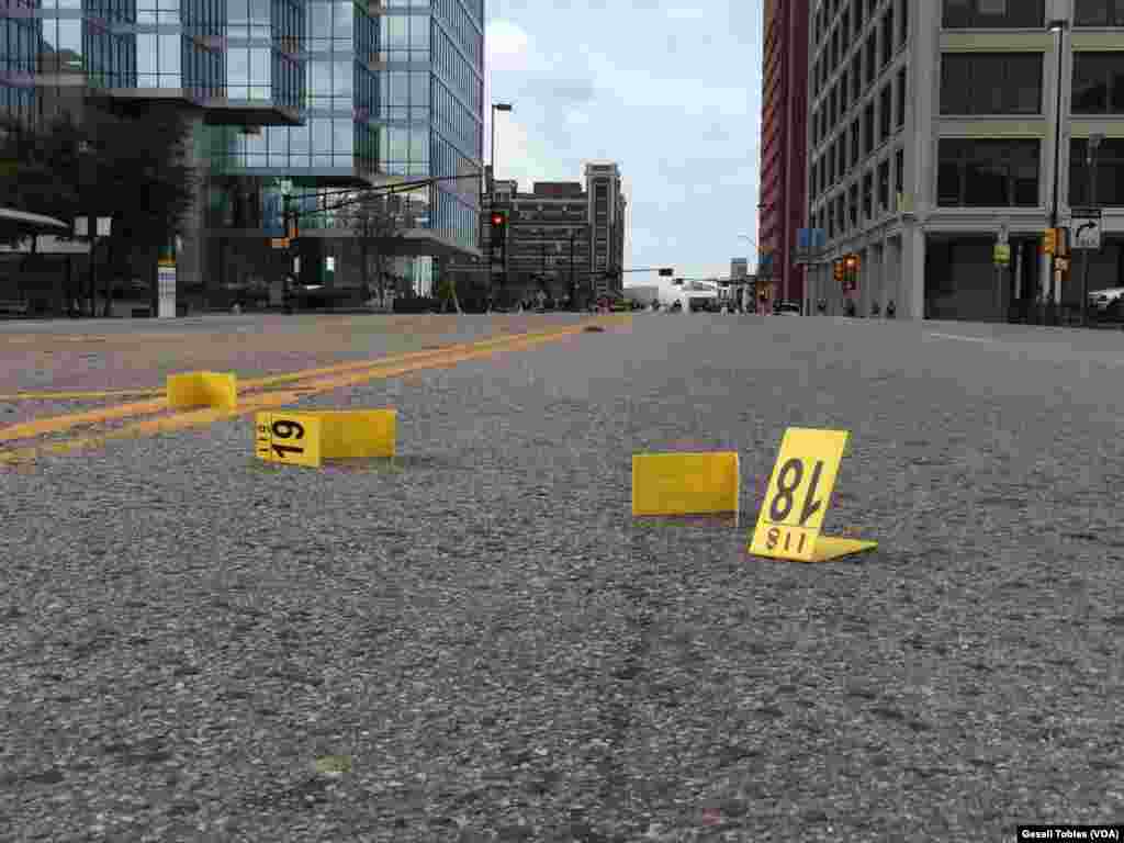 Law enforcement personnel investigate a mass shooting scene after an attack that killed and wounded Dallas police officers, in Dallas, Texas, July 8, 2016. 