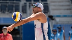 United States' Phil Dalhausser makes a dig at the 2020 Summer Olympics, July 29, 2021, in Tokyo, Japan.