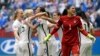 United States' Carli Lloyd (3-L) celebrates with teammates, including goalkeeper Hope Solo (1), after Lloyd scored her third goal against Japan during the first half of the Women's World Cup soccer championship in Vancouver, Canada, July 5, 2015.