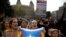 People wearing yellow ribbons in support of jailed pro-independence politicians and carrying Estelada pro-independence flags protest in Barcelona, Spain, Oct. 14, 2019.