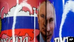 Coffee mugs with a pictures of Russian President Vladimir Putin on sale on the main pedestrian street in downtown Belgrade, Serbia, Jan. 16, 2023.