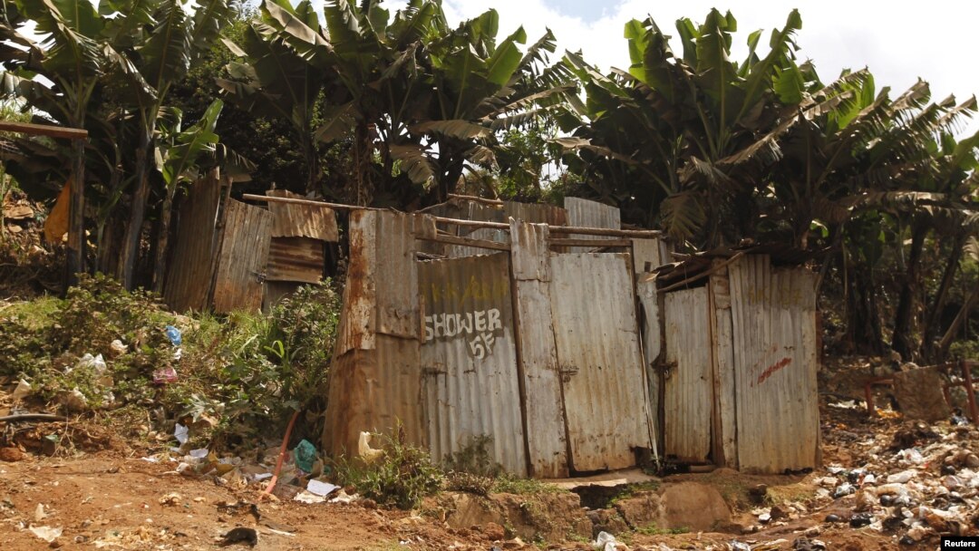 FILE - A public toilet made of rusty sheets of metal stands in Gatwekera village in Kibera slum in Nairobi, Kenya, October 12, 2015. A new project is using solar energy to transform toilet waste into efficient cooking fuel, in an initiative to improve hygiene for people in communities.