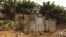 FILE - A public toilet made of rusty sheets of metal stands in Gatwekera village in Kibera slum in Nairobi, Kenya, October 12, 2015. A new project is using solar energy to transform toilet waste into efficient cooking fuel, in an initiative to improve hygiene for people in communities.