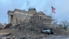 Damage from a storm through that rolled through the night before is seen at the heart of downtown, Dec. 29, 2024, in Athens, Alabama.