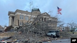 Damage from a storm through that rolled through the night before is seen at the heart of downtown, Dec. 29, 2024, in Athens, Alabama.