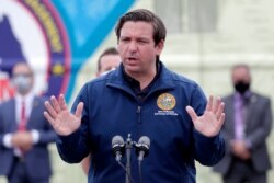 Florida Gov. Ron DeSantis speaks during a news conference at a COVID-19 testing site at Hard Rock Stadium, during the new coronavirus pandemic, May 6, 2020, in Miami Gardens, Fla.