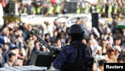 A member of Houthi security forces mans a machine gun mounted on a patrol truck at the site of a rally held by protesters, mainly Houthi supporters, to show support to Palestinians in the Gaza Strip, in Sanaa, Yemen, on Dec. 27, 2024.