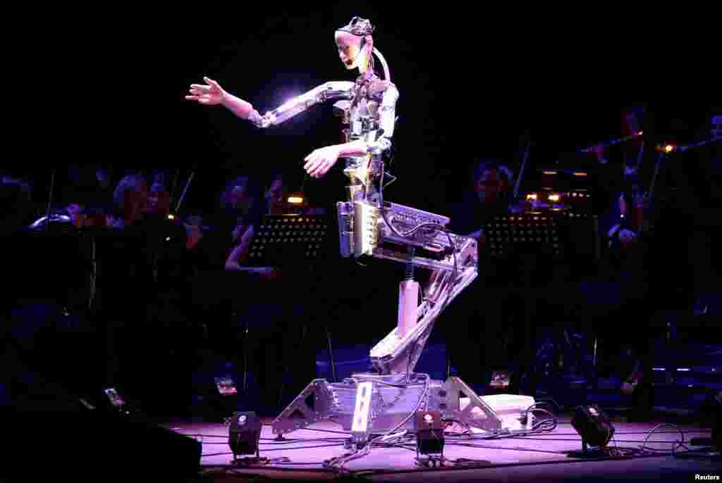 A robot maestro leads an orchestra at the Sharjah Performing Arts Academy in Sharjah, UAE.