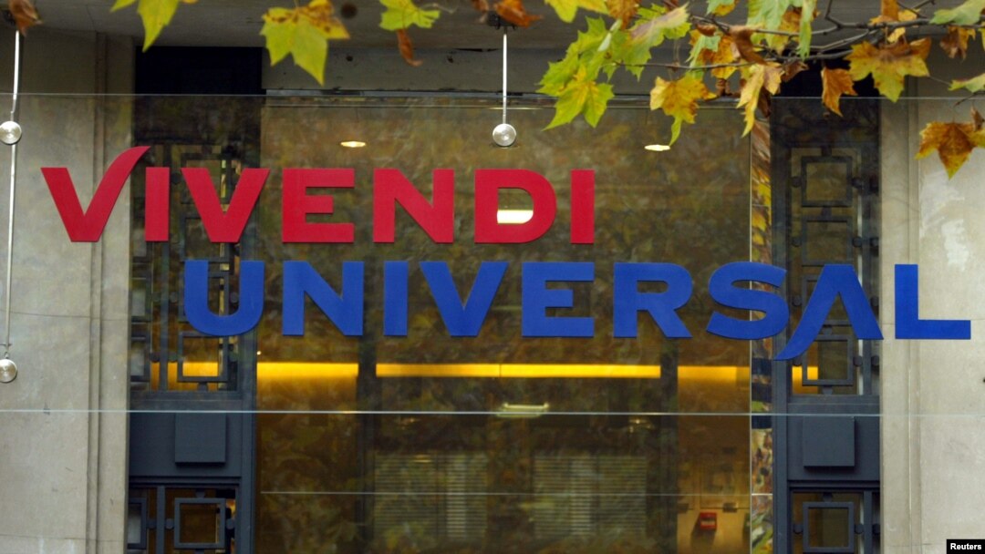 FILE - The logo of Vivendi Universal is seen on top on the main entrance at the company's headquarters in Paris, Nov. 17, 2003. 