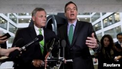 Senate Intelligence Committee Chairman Richard Burr (L) and ranking member Senator Mark Warner (R) speak about former White House national security adviser Michael Flynn following a Senate Select Committee on Intelligence briefing on Capitol Hill in Washington, May 23, 2017.