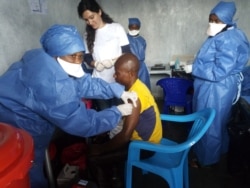 FILE - This handout picture released by Doctors Without Borders (MSF) Nov. 14, 2019, shows a man receiving his first injection of the new Ebola vaccine, at the MSF facilities in Goma, North Kivu province, DRC.
