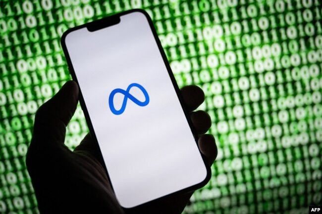 This illustration taken on October 30, 2023, shows the Meta (former Facebook) logo on a smartphone in Mulhouse, eastern France. (Photo by SEBASTIEN BOZON / AFP)