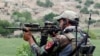 A member of Afghanistan's special forces points his gun as he observes the enemy lines in Achin district of Nangarhar province in eastern Afghanistan, April 23, 2017. 