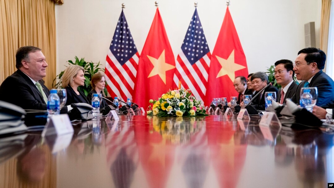 U.S. Secretary of State Mike Pompeo, left, meets with Vietnamese Deputy Prime Minister and Foreign Minister Pham Binh Minh, right, at the Ministry of Foreign Affairs in Hanoi, Vietnam, July 9, 2018