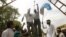 Pakistani students hang an effigy of US pastor Terry Jones at a rally to protest against the making of a film insulting the Prophet Muhammad at Karachi University in Pakistan, September 26, 2012.