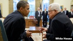 President Barack Obama and President Mahmoud Abbas of the Palestinian Authority talk following their statement to the press in the Oval Office, June 9, 2010. (Official White House Photo by Pete Souza)