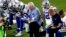 The Dallas Cowboys, led by owner Jerry Jones, center, take a knee before the national anthem at an NFL football game against the Arizona Cardinals, in Glendale, Ariz., Sept. 25, 2017.