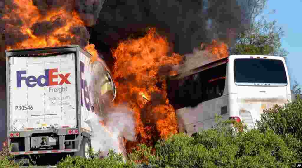 Massive flames are seen devouring both vehicles just after the crash, and clouds of smoke billowed into the sky April 10, 2014 until firefighters had quenched the fire, leaving behind scorched black hulks of metal. The FedEx tractor-trailer crossed a grassy freeway median in Northern California and slammed into the bus carrying high school students on a visit to a college. At least 10 were killed in the fiery crash.