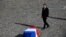 French President Emmanuel Macron stands in front of the coffin of former French president Jacques Chirac during a military tribute at the Invalides (Hotel des Invalides) in Paris, Sept. 30, 2019.