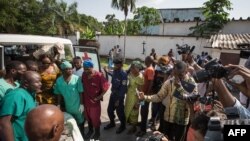 The body of a elderly woman is shown to the press at Kinshasa central morgue, on April 13, 2015, where the local governement organized a visit to highlight the need for mass graves after more than 420 bodies were discovered 100 km outside Kinshasa. 