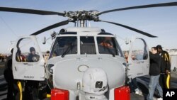 FILE - A navy MH-60R Seahawk helicopter aboard the USS Ronald Reagan aircraft carrier, Dec. 23, 2007, in San Diego.