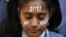 A student prays during a vigil for a gang rape victim, who was assaulted in New Delhi, in Ahmedabad, India, December 31, 2012. 