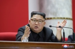 FILE - North Korean leader Kim Jong Un attends the 5th Plenary Meeting of the 7th Central Committee of the Workers' Party of Korea (WPK) in this undated photo released Dec. 31, 2019, by North Korean Central News Agency (KCNA).