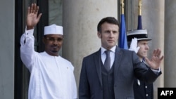 FILE - French President Emmanuel Macron, right, welcomes Chadian President Mahamat Idriss Deby prior to a meeting at the Elysee palace in Paris on Feb. 6, 2023. Deby said that remarks made by Macron on Jan. 6, 2025, dishonored and disrespected Africa. 