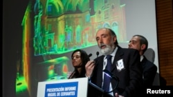 Forensic archaeologist Francisco Etxeberria, center, historian Francisco Marin, right, and forensic anthropologist Almudena Garcia speak about the search of the remains of Spanish writer Miguel de Cervantes in Madrid March 17, 2015. 