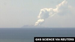Smoke bellows from Whakaari, also known as White Island, volcano as it erupts in New Zealand, December 9, 2019, in this image obtained via social media. GNS Science via REUTERS ATTENTION EDITORS - THIS IMAGE HAS BEEN SUPPLIED BY A THIRD PARTY…
