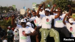 FILE -- Supporters of Edgar Lungu, leader of the Patriotic Front, celebrate after Lungu narrowly won re-election. The party of rival Hakainde Hichilema has since suspended a vice president.