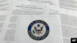 The report from Democrats on the House Intelligence Committee on the impeachment inquiry into President Donald Trump is photographed in Washington, Dec. 3, 2019. 