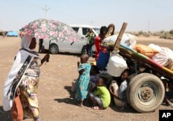 Refugees from the Tigray region of Ethiopia wait to register at the UNHCR center at Hamdayat, Sudan, Nov. 14, 2020.