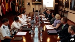 Philippine and U.S. negotiators discussing U.S. troop presence in the Philippines are seen meeting at the Department of National Defense headquarters in Quezon city, north of Manila, in this August 14, 2013, file photo. 