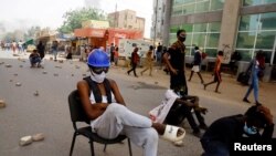 FILE: Protesters march during a rally against the country's military rulers in Khartoum, Sudan, May 19, 2022.