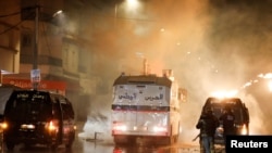 Security forces clash with demonstrators during anti-government protests in Tunis, Tunisia, Jan. 18, 2021. 