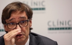 FILE - Spain's Health Minister Salvador Illa speaks at Hospital Clinic in Barcelona, Spain, Feb. 12, 2020.
